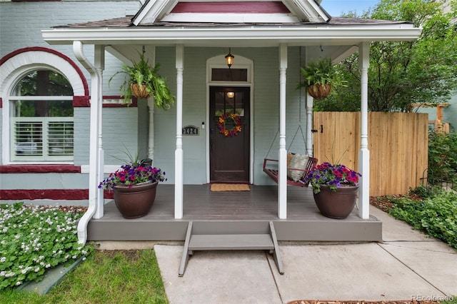 3424 W 31st Ave, Denver, CO 80211 - property entrance with a porch, brick siding, and a shingled roof