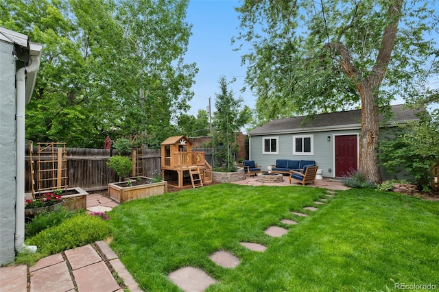 3424 W 31st Ave, Denver, CO 80211 - view of yard with a vegetable garden, an outdoor living space with a fire pit, a patio area, and a playground