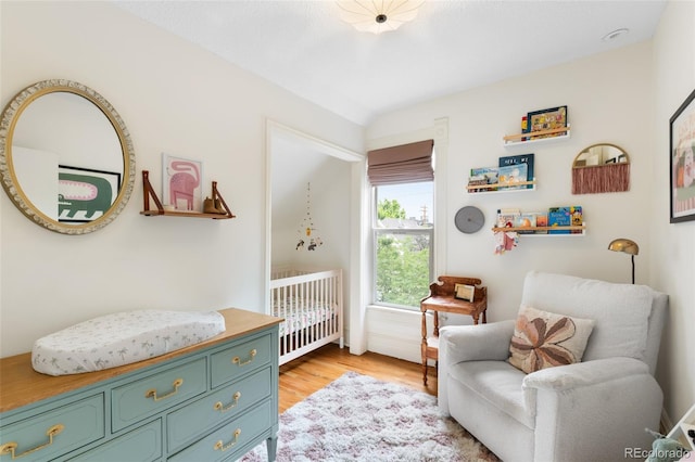 3424 W 31st Ave, Denver, CO 80211 - bedroom featuring light wood-type flooring and a nursery area