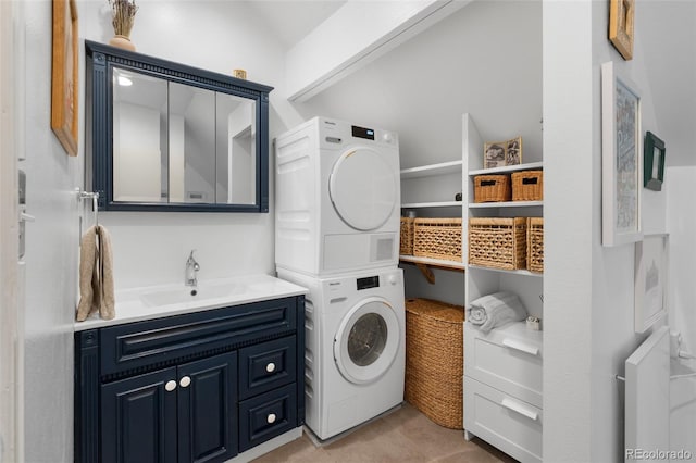 3424 W 31st Ave, Denver, CO 80211 - laundry area with stacked washer and clothes dryer, a sink, and light tile patterned floors