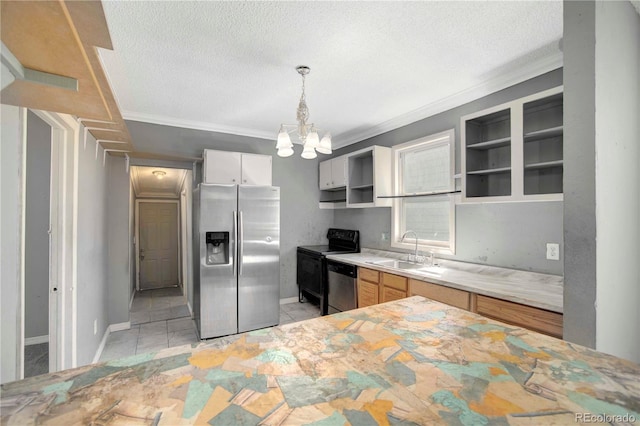 kitchen featuring a textured ceiling, an inviting chandelier, decorative light fixtures, stainless steel appliances, and sink