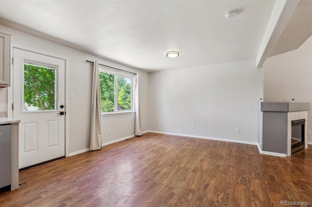 5441 Lynx St, Frederick, CO 80504 - unfurnished living room featuring wood finished floors and baseboards