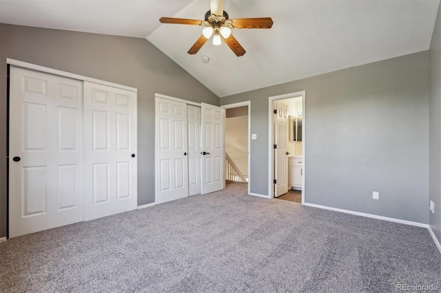 5441 Lynx St, Frederick, CO 80504 - unfurnished bedroom with two closets, vaulted ceiling, carpet floors, ensuite bath, and baseboards