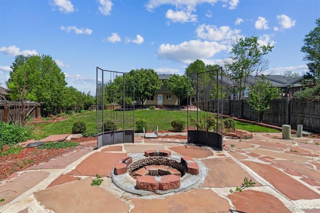 5441 Lynx St, Frederick, CO 80504 - view of patio featuring a fire pit