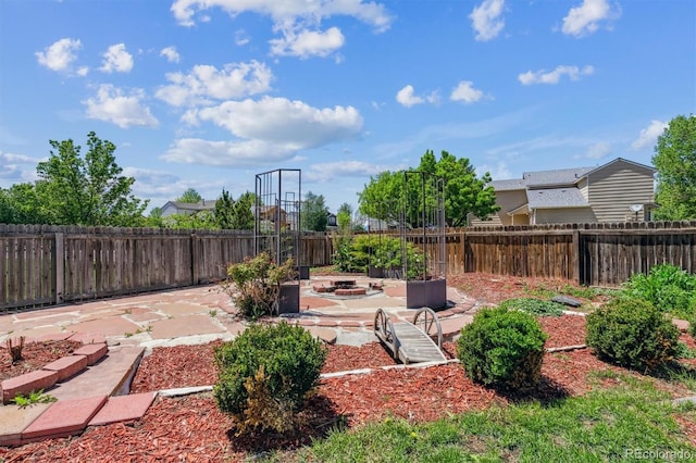 5441 Lynx St, Frederick, CO 80504 - fenced backyard with a patio and an outdoor fire pit