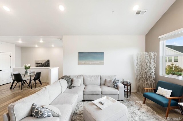 2078 Autumn Moon Dr Unit 3, Windsor, CO 80550 - living room with light wood-style flooring, recessed lighting, and vaulted ceiling