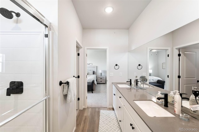 2078 Autumn Moon Dr Unit 3, Windsor, CO 80550 - ensuite bathroom with wood finished floors and double vanity