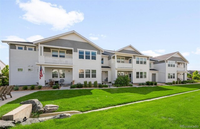 2078 Autumn Moon Dr Unit 3, Windsor, CO 80550 - view of front of house with a balcony and a front lawn