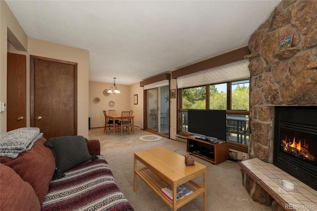 300 Sterling Way Unit 3, Fraser, CO 80442 - living room with a fireplace, a chandelier, and carpet floors