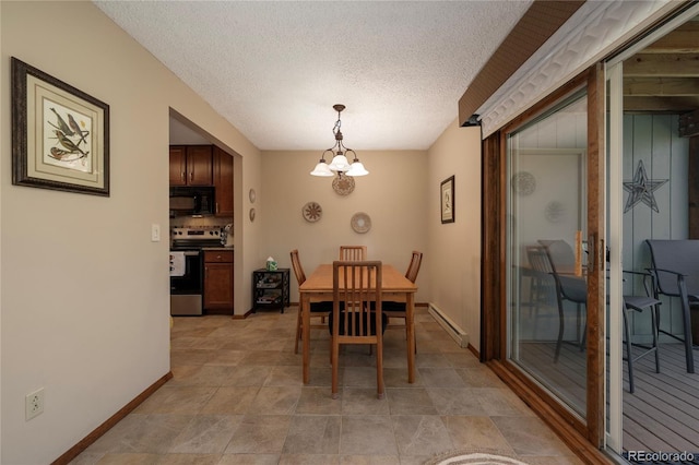 300 Sterling Way Unit 3, Fraser, CO 80442 - dining room with baseboard heating, baseboards, a chandelier, and a textured ceiling