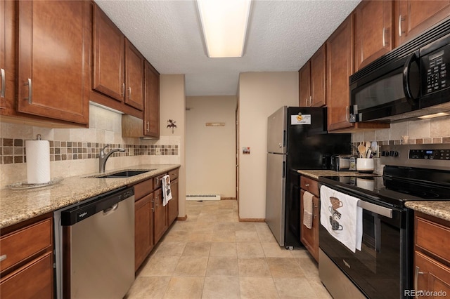 300 Sterling Way Unit 3, Fraser, CO 80442 - kitchen with appliances with stainless steel finishes, a sink, tasteful backsplash, light stone counters, and a textured ceiling