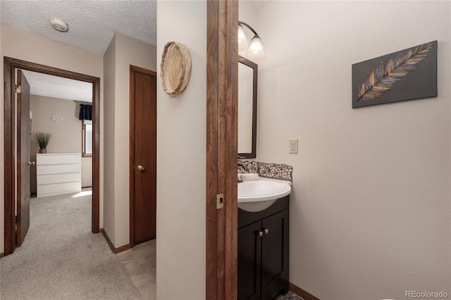 300 Sterling Way Unit 3, Fraser, CO 80442 - bathroom featuring vanity and a textured ceiling
