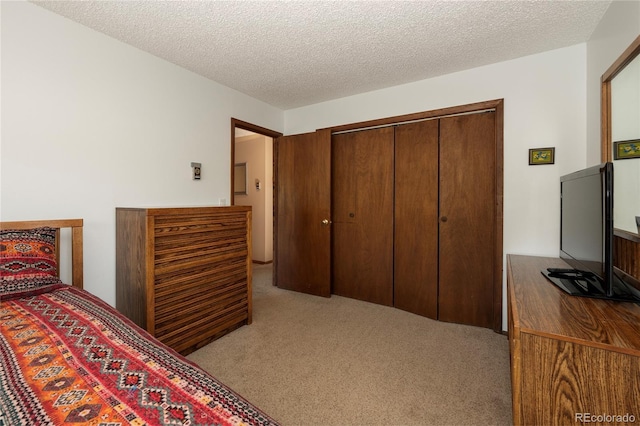 300 Sterling Way Unit 3, Fraser, CO 80442 - carpeted bedroom featuring a textured ceiling and a closet
