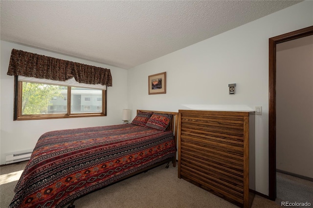 300 Sterling Way Unit 3, Fraser, CO 80442 - bedroom with a baseboard heating unit and carpet floors