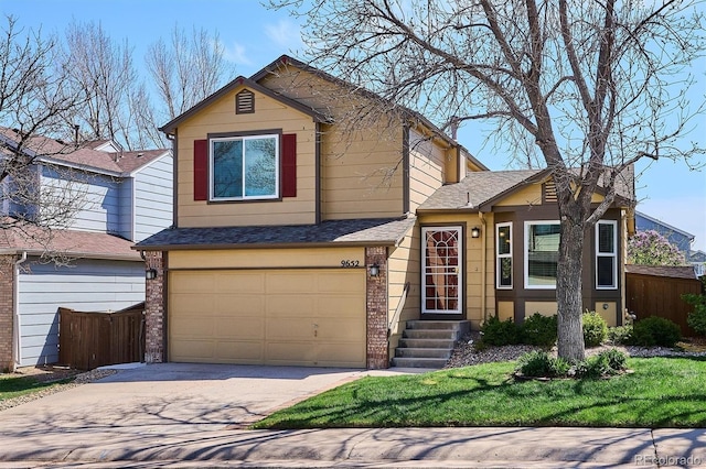 view of front of house featuring an attached garage, fence, driveway, and brick siding