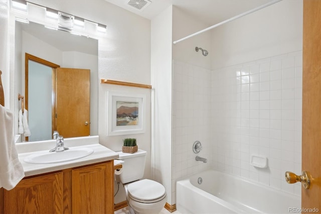 bathroom featuring visible vents, bathing tub / shower combination, toilet, and vanity