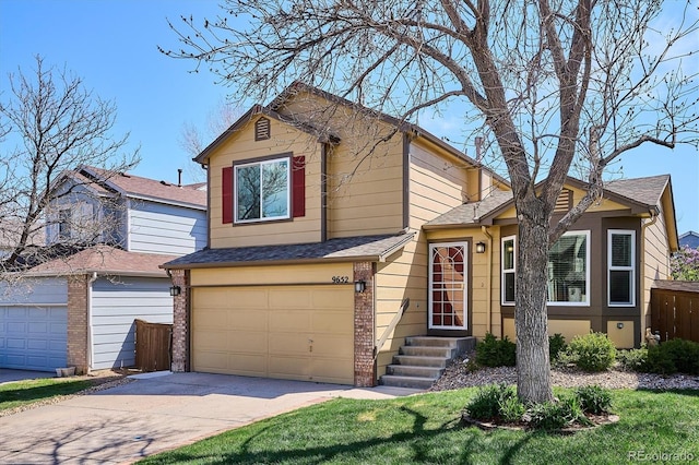 split level home with roof with shingles, a garage, fence, concrete driveway, and entry steps