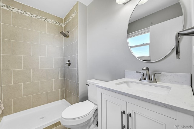 19155 E Kansas Dr, Aurora, CO 80017 - bathroom with toilet, tiled shower, and vanity
