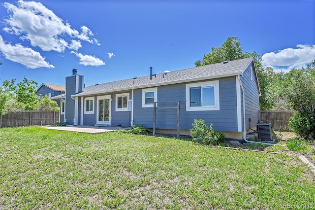 19155 E Kansas Dr, Aurora, CO 80017 - rear view of property with a patio, central AC unit, and a chimney