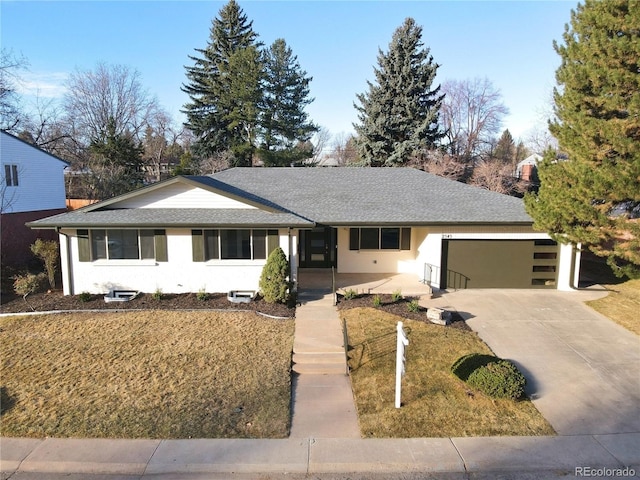 ranch-style home with stucco siding, an attached garage, concrete driveway, and roof with shingles