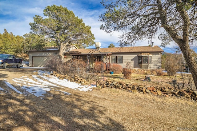 single story home featuring a garage