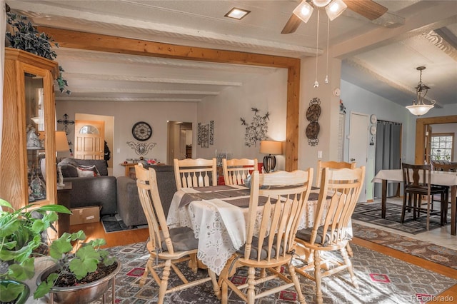 dining area with vaulted ceiling with beams, wood-type flooring, and ceiling fan