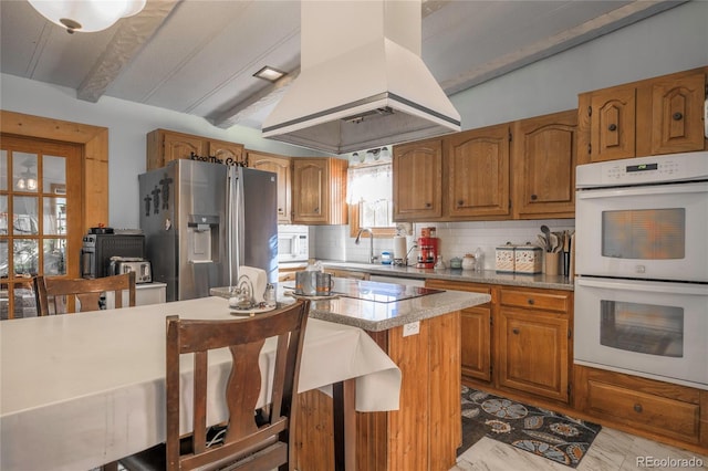 kitchen with sink, white appliances, a center island, tasteful backsplash, and island range hood