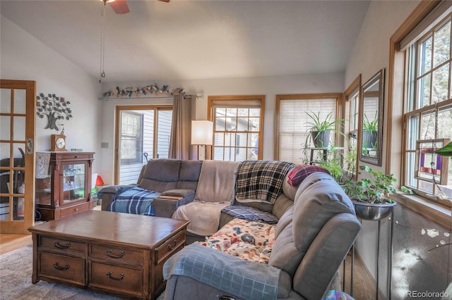 living room with vaulted ceiling, a healthy amount of sunlight, and ceiling fan