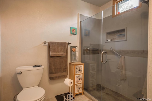 bathroom with walk in shower and toilet