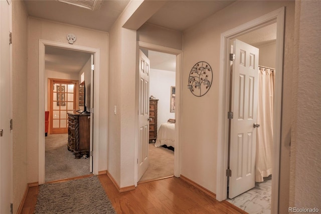 hall with light wood-type flooring