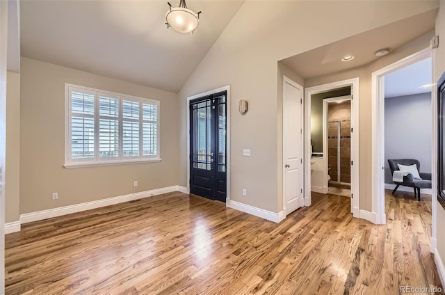 940 Kearney St, Denver, CO 80220 - entryway with light wood-style floors and vaulted ceiling