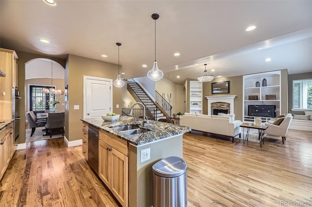 940 Kearney St, Denver, CO 80220 - kitchen featuring dishwasher, light brown cabinetry, recessed lighting, light wood-style floors, and a chandelier
