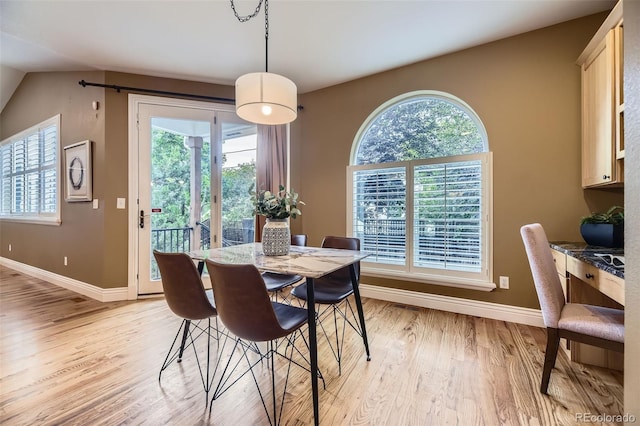940 Kearney St, Denver, CO 80220 - dining space featuring light wood finished floors and vaulted ceiling