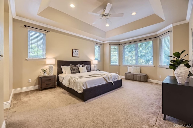 940 Kearney St, Denver, CO 80220 - carpeted bedroom featuring a tray ceiling, multiple windows, crown molding, recessed lighting, and a ceiling fan