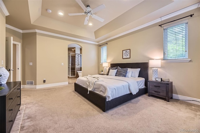 940 Kearney St, Denver, CO 80220 - bedroom with arched walkways, a tray ceiling, light carpet, ornamental molding, and recessed lighting