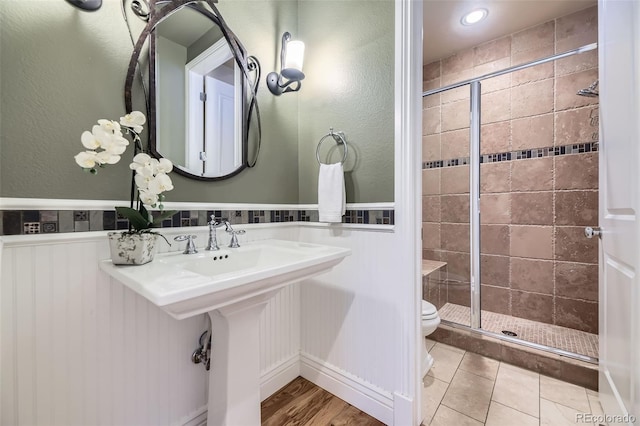 940 Kearney St, Denver, CO 80220 - bathroom featuring a stall shower and wainscoting