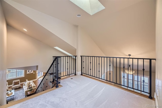940 Kearney St, Denver, CO 80220 - hall featuring a skylight, carpet, and high vaulted ceiling