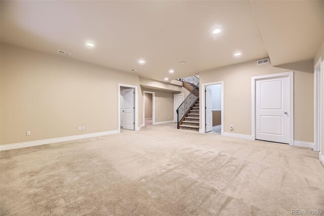940 Kearney St, Denver, CO 80220 - basement with light carpet, stairway, and recessed lighting