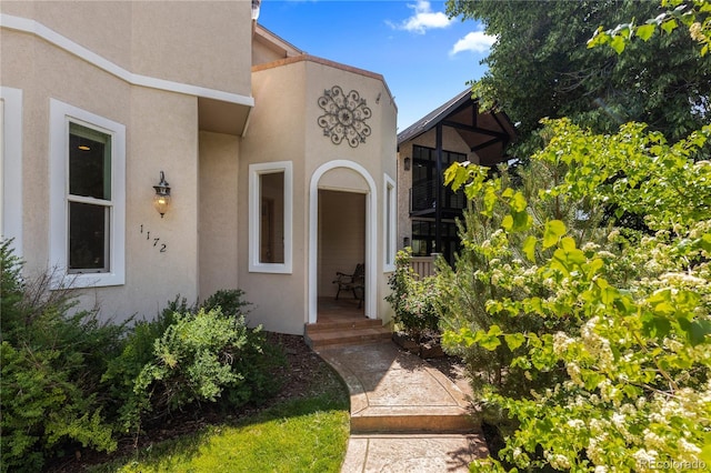 1172 S Steele St, Denver, CO 80210 - property entrance featuring stucco siding