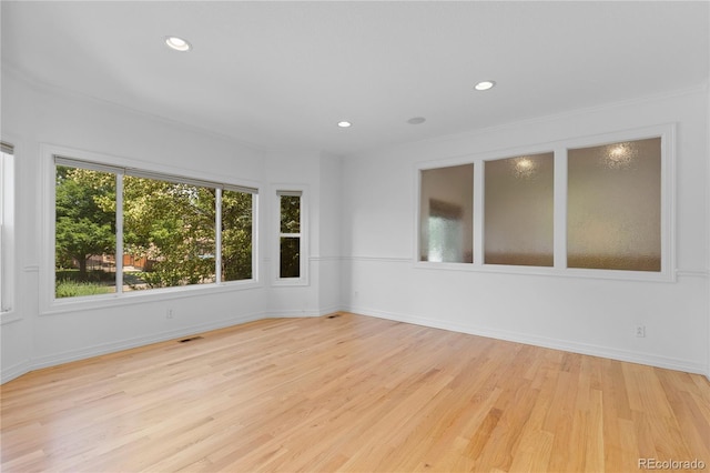 1172 S Steele St, Denver, CO 80210 - empty room with wood finished floors, recessed lighting, and ornamental molding
