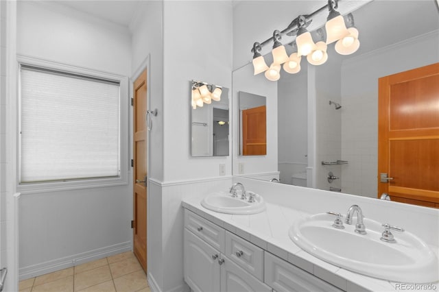 1172 S Steele St, Denver, CO 80210 - full bath with double vanity, ornamental molding, a tile shower, and tile patterned floors