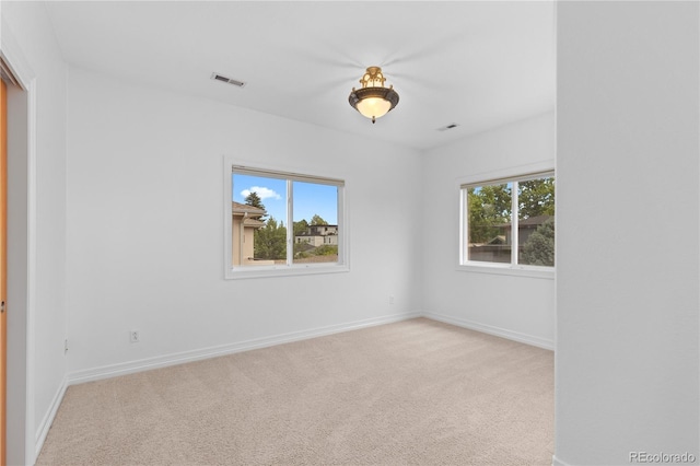 1172 S Steele St, Denver, CO 80210 - carpeted empty room featuring baseboards