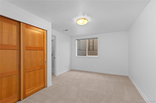 1172 S Steele St, Denver, CO 80210 - unfurnished bedroom with light colored carpet and a closet