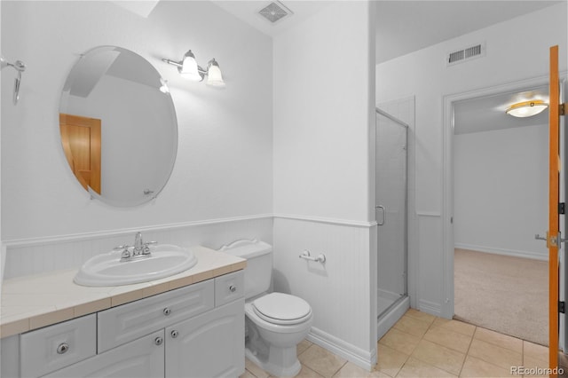 1172 S Steele St, Denver, CO 80210 - full bath featuring vanity, a shower stall, a wainscoted wall, and tile patterned flooring