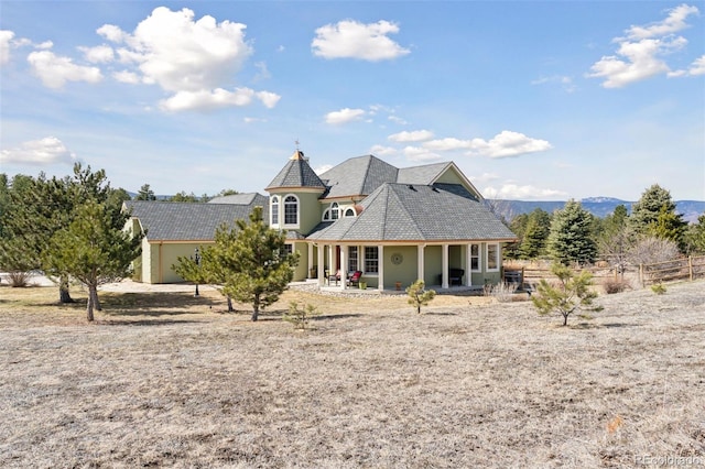 rear view of house with fence