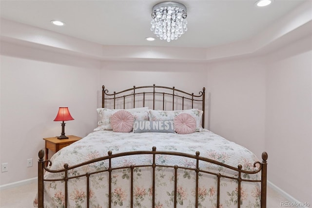 carpeted bedroom with recessed lighting, an inviting chandelier, and baseboards