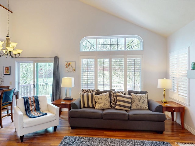 9864 Carmel Ct, Lone Tree, CO 80124 - living room with a chandelier, wood finished floors, and high vaulted ceiling