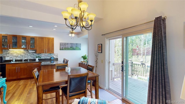 9864 Carmel Ct, Lone Tree, CO 80124 - dining area with light wood-style flooring, a chandelier, and recessed lighting