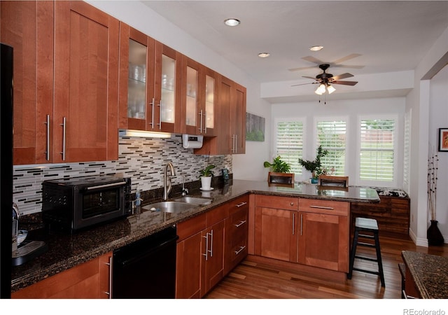 9864 Carmel Ct, Lone Tree, CO 80124 - kitchen with dishwasher, ceiling fan, wood finished floors, tasteful backsplash, and recessed lighting