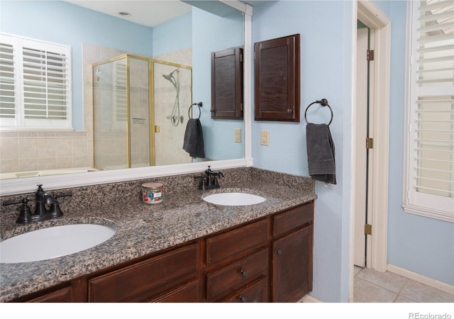 9864 Carmel Ct, Lone Tree, CO 80124 - full bath featuring a shower stall, double vanity, tile patterned floors, and a tub